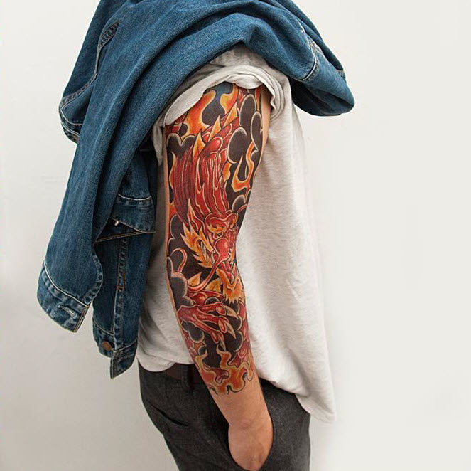Blackwork negative space dragon sleeve tattoo idea | TattoosAI